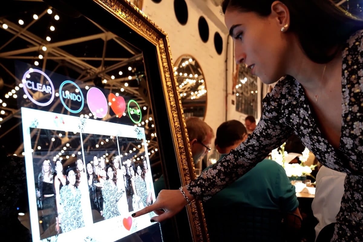 Women trying the Magic mirror photo booth - Cotswolds